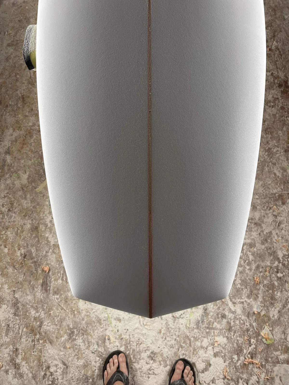 Close view of a crisp surfboard tail shaped from foam